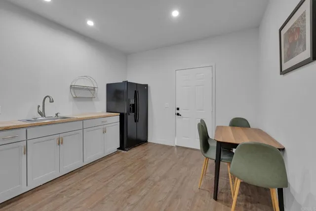 a living room with furniture and a lamp