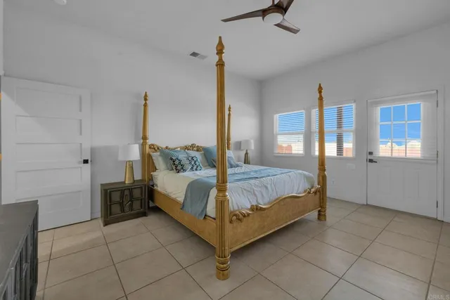 a bedroom with a bed and walk in closet