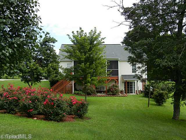 8625 Circle Drive Rural Hall, NC 27045 - Photo 2 of 16 Yard/Garden. Just look at this beautifully landscaped level lot. The seller added the roof over the sliding doors of the walk out basement.