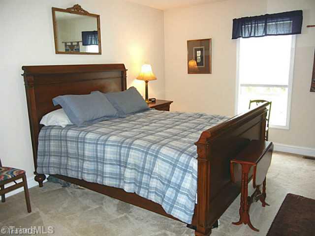 8625 Circle Drive Rural Hall, NC 27045 - Photo 11 of 16 Master Bedroom. Main level master bedroom has a walk in closet and private bath.