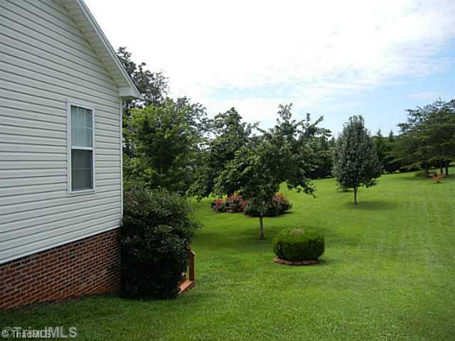 8625 Circle Drive Rural Hall, NC 27045 - Photo 15 of 16 Yard/Garden. Meticulously maintained yard with mature landscaping. Pride of ownership!