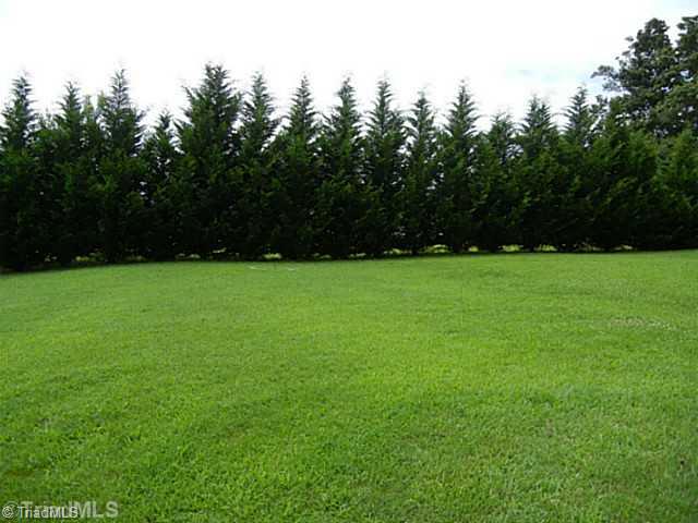8625 Circle Drive Rural Hall, NC 27045 - Photo 16 of 16 Yard/Garden. This is a view of the back of the lot showing the trees that make this a private lot where you cannot see another house behind you.