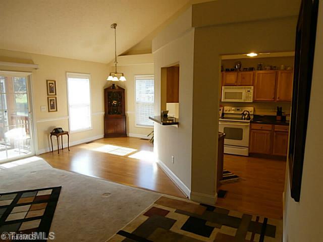 8625 Circle Drive Rural Hall, NC 27045 - Photo 4 of 16 Den/Family/Great Room. Another view of the Great Room which has sliding glass leading to the screened porch. Vaulted ceiling in the GR, Dining Area and kitchen.
