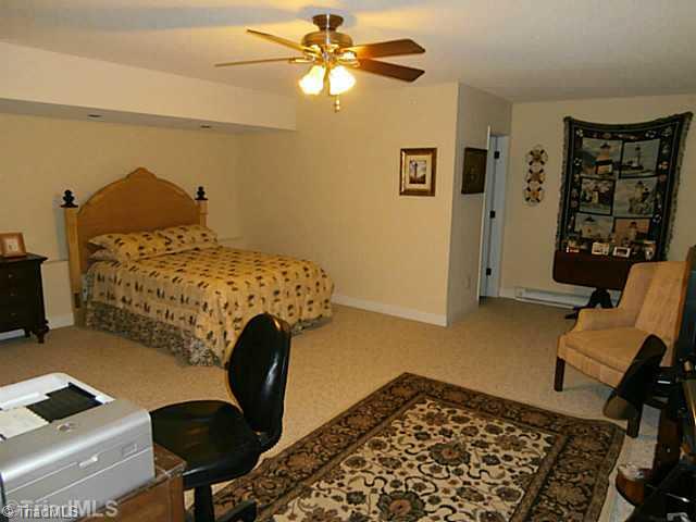 8625 Circle Drive Rural Hall, NC 27045 - Photo 8 of 16 Bonus. Large lower level bonus room has a ceiling fan (which has a full bath and could be used for a 4th BR). Spacious enough to hold 2 queen sized beds, desk area and more!