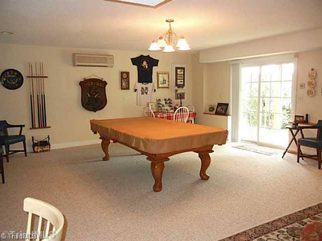 8625 Circle Drive Rural Hall, NC 27045 - Photo 9 of 16 Playroom. Large daylight playroom with recessed lighting, overhead lighting and sliding doors to a covered patio area. This room has a separate heating/cooling system. The pool table and the freestanding bar are for sale.