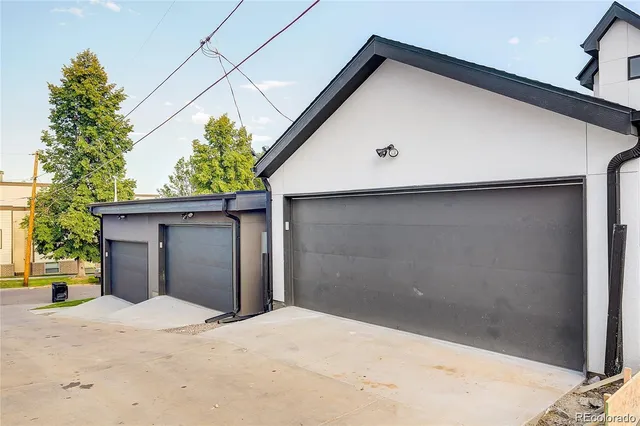 a view of wooden house and a yard