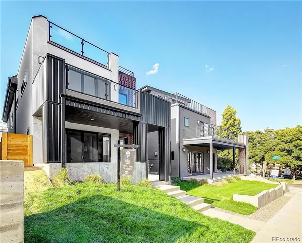a view of a house with a yard and front a house