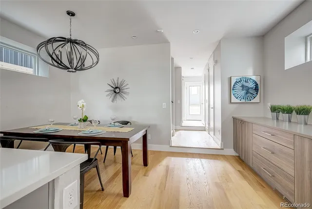 a view of a dining room with furniture window and wooden floor