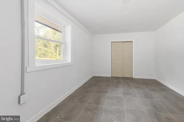 an empty room with windows