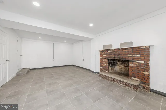 an empty room with a fireplace