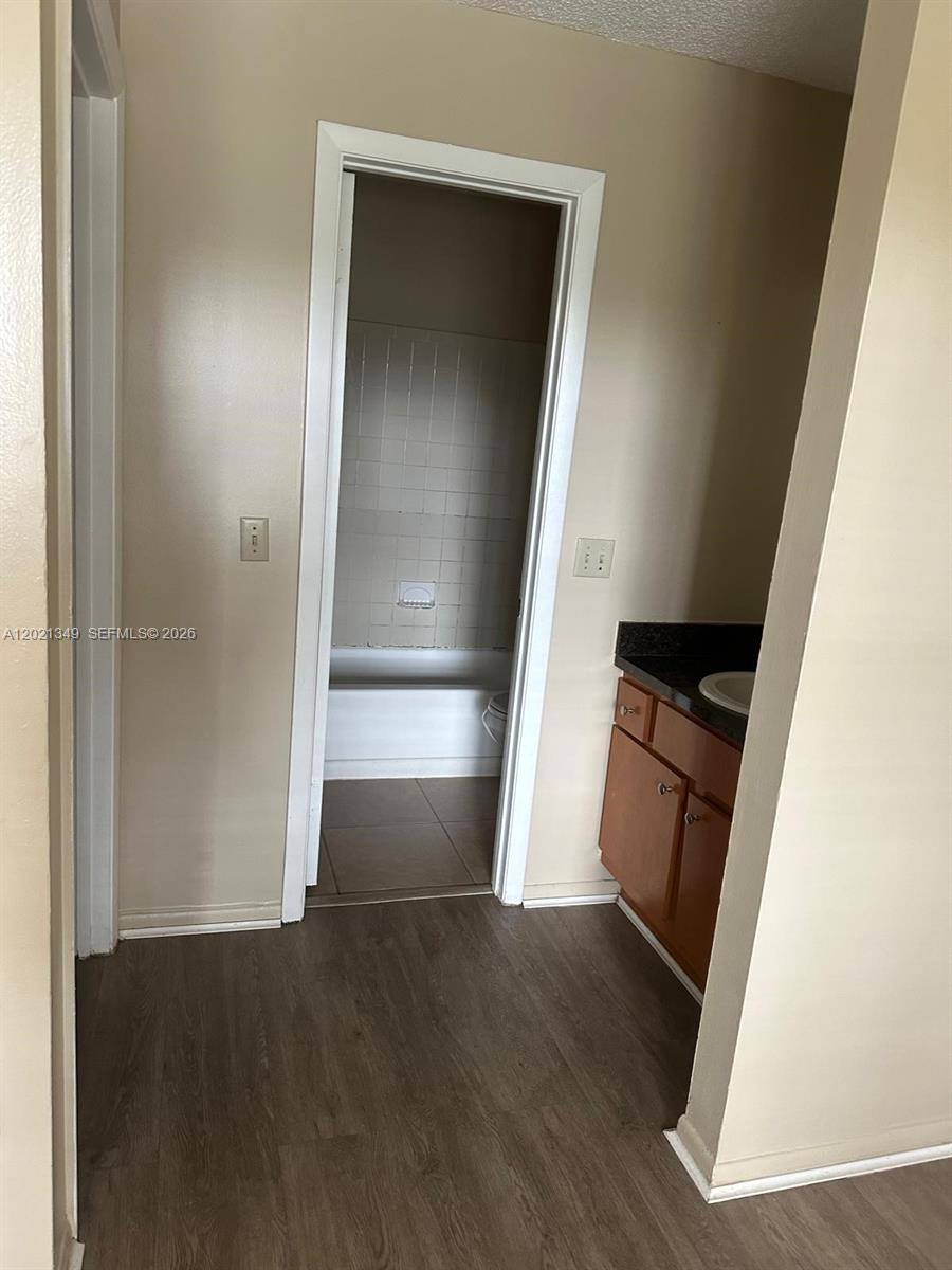 4481 West McNab Road, Unit 37 Pompano Beach, FL 33069 - Photo 17 of 20 wooden floor in an empty room