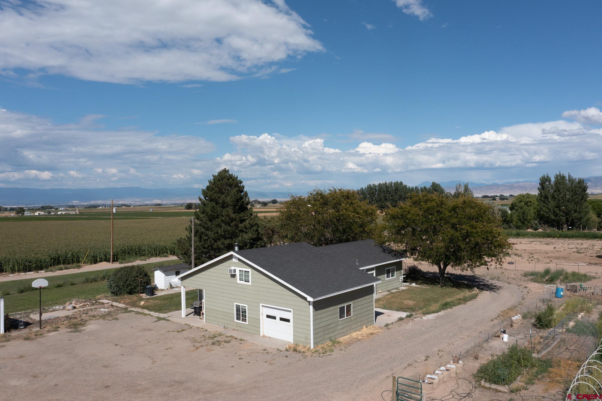 a aerial view of a house with a yard