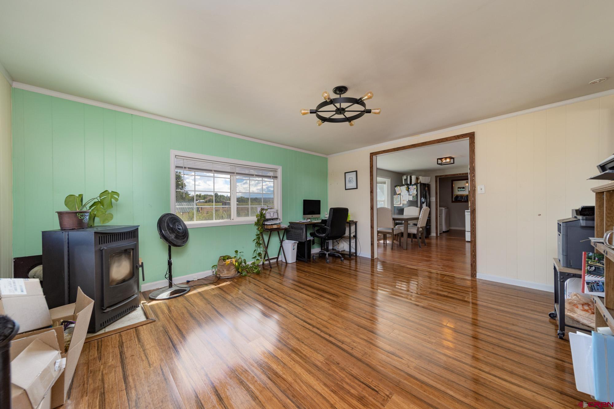 52888 Cornflower Road Delta, CO 81416 - Photo 22 of 28 a living room with furniture and wooden floor