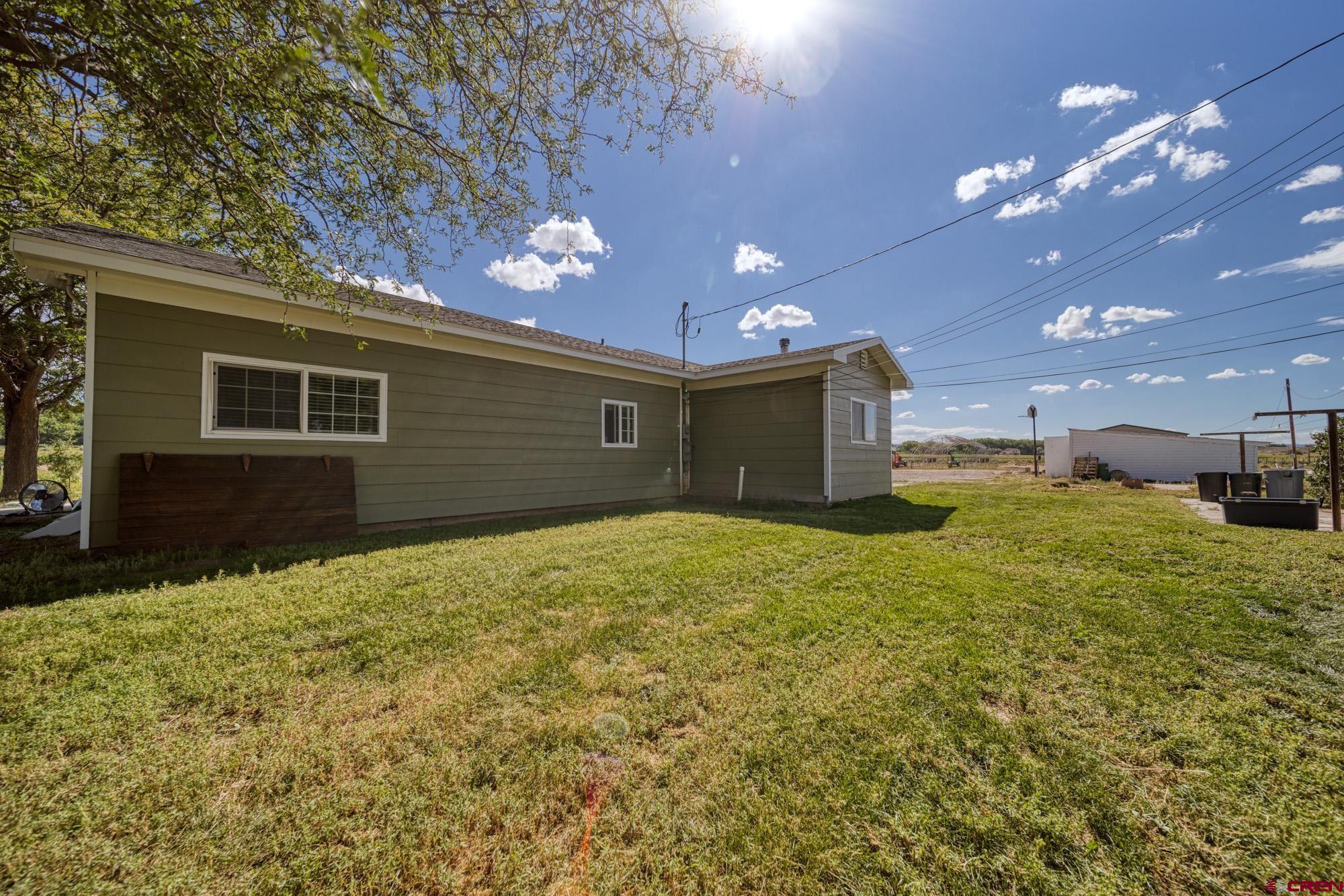 52888 Cornflower Road Delta, CO 81416 - Photo 26 of 28 a view of a house with a yard