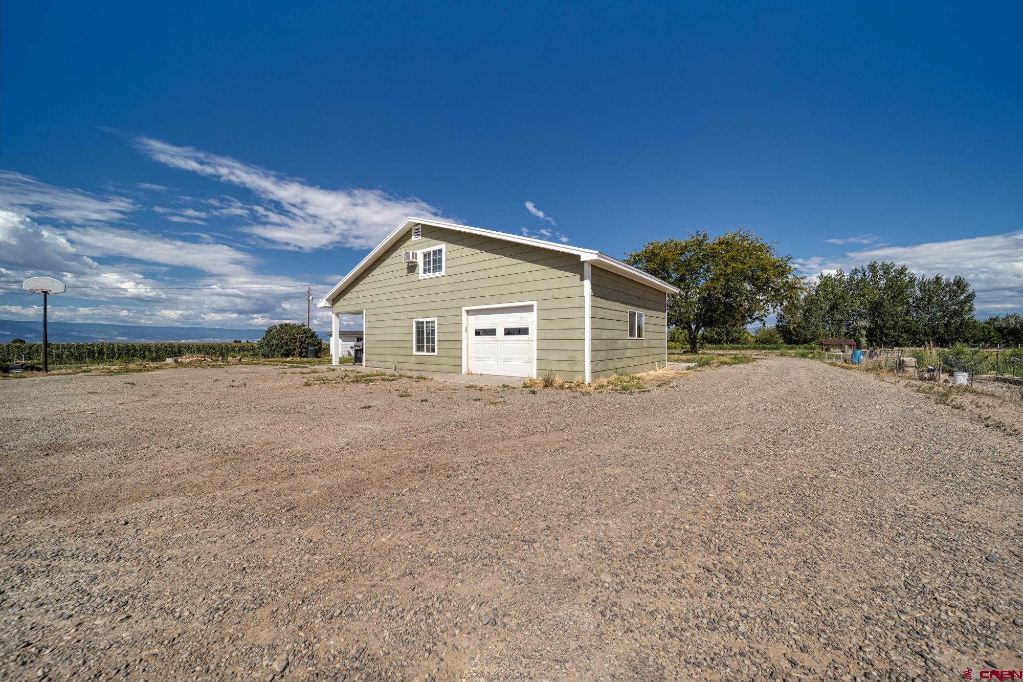 52888 Cornflower Road Delta, CO 81416 - Photo 4 of 28 a view of a house with a backyard