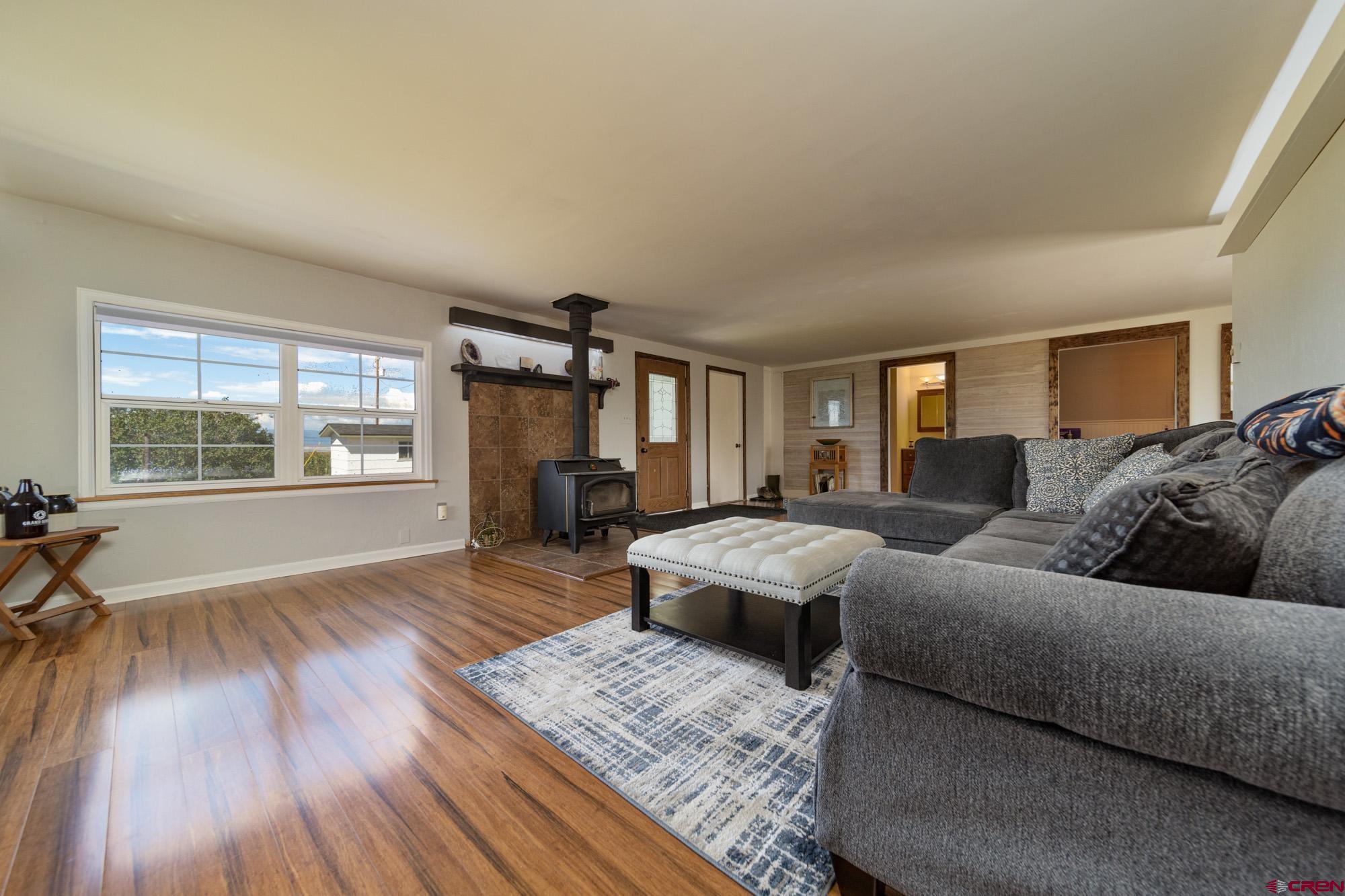 52888 Cornflower Road Delta, CO 81416 - Photo 6 of 28 a living room with furniture and a wooden floor