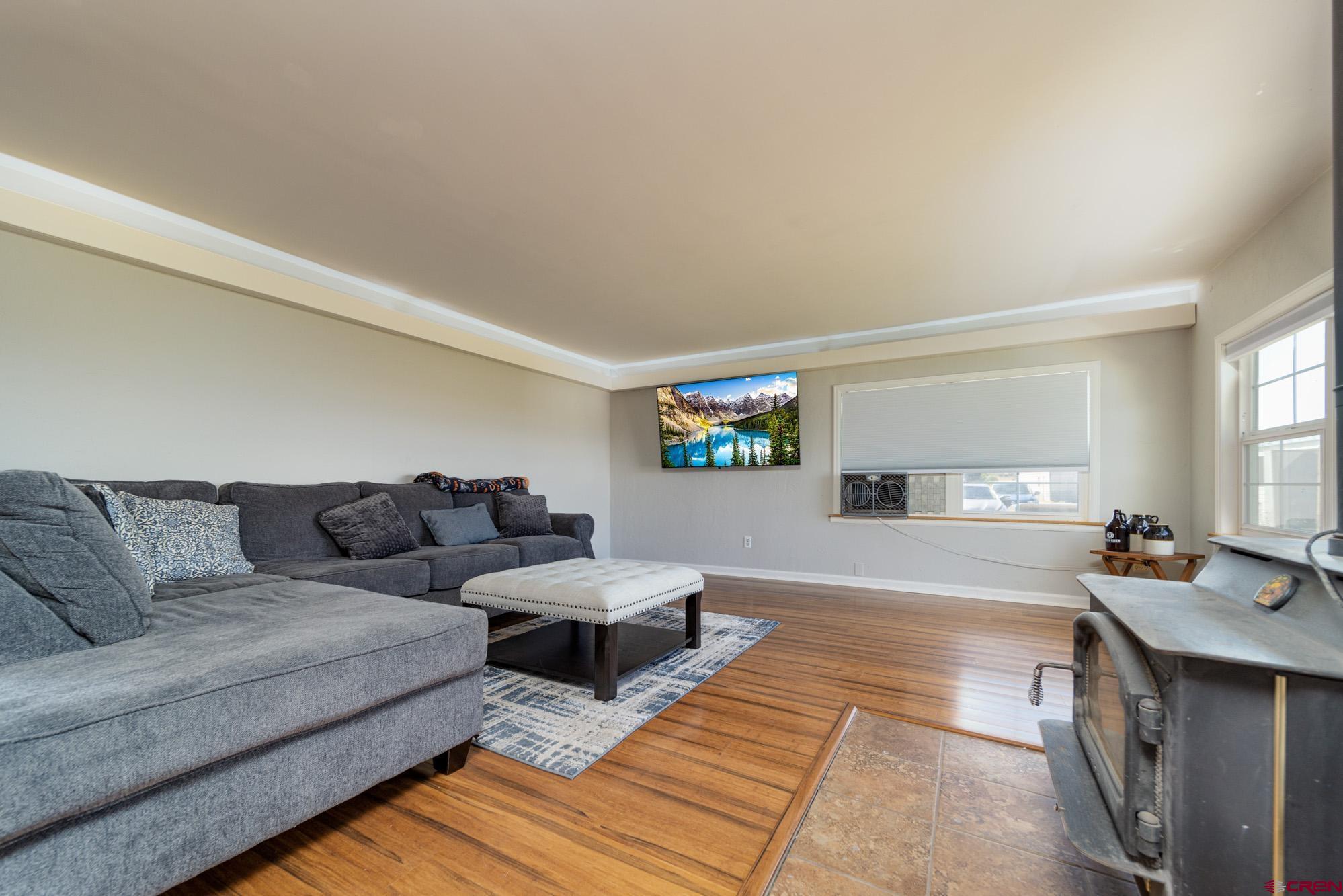 52888 Cornflower Road Delta, CO 81416 - Photo 7 of 28 a living room with couches and a flat screen tv