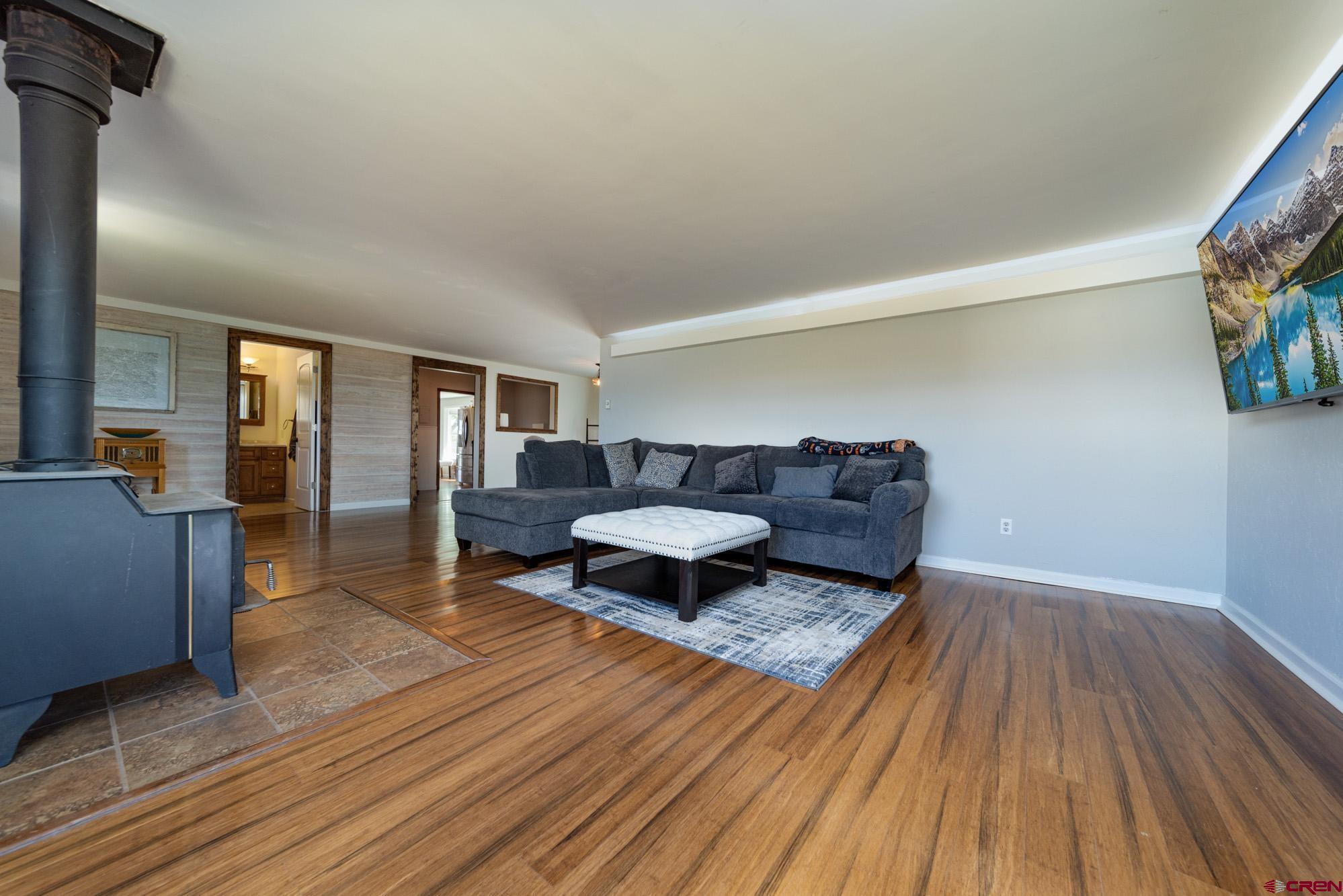 52888 Cornflower Road Delta, CO 81416 - Photo 8 of 28 a living room with furniture and a wooden floor