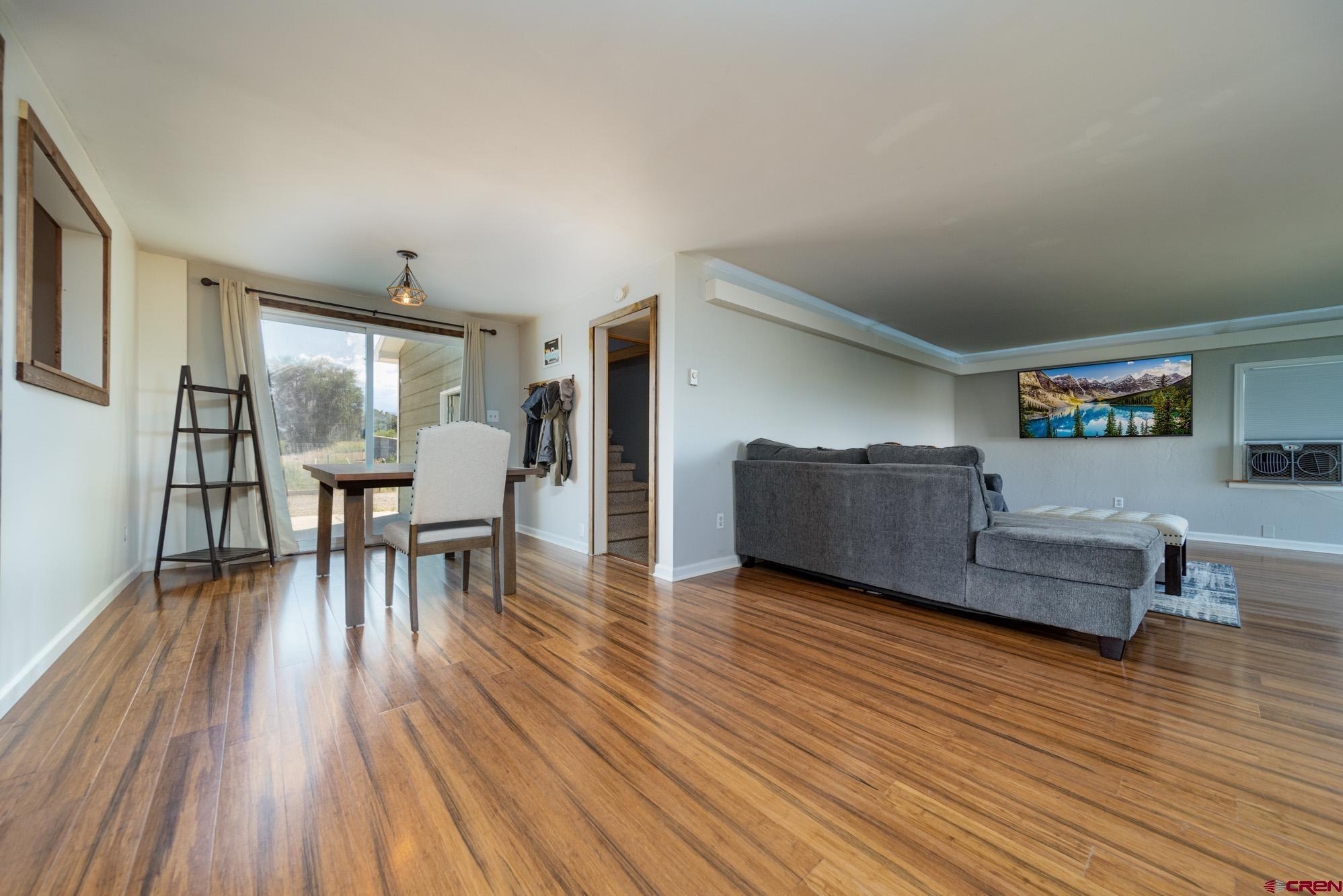 52888 Cornflower Road Delta, CO 81416 - Photo 9 of 28 a living room with furniture and a wooden floor