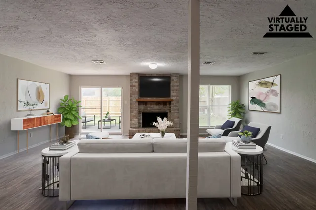 a living room with furniture and a fireplace