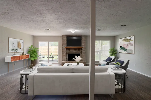 a living room with furniture and a fireplace