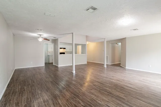 a view of a livingroom with wooden floor