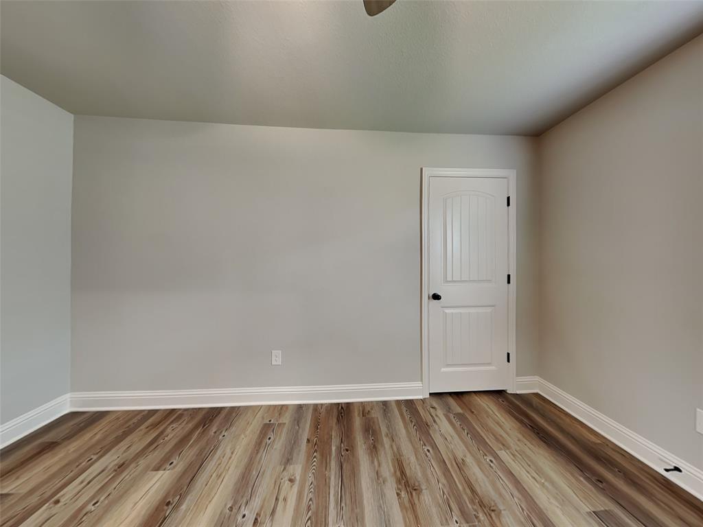 2108 Gabriel Drive Sherman, TX 75092 - Photo 11 of 16 a view of an empty room and wooden floor