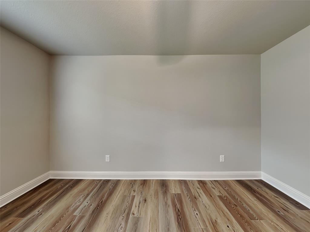2108 Gabriel Drive Sherman, TX 75092 - Photo 12 of 16 a view of an empty room and wooden floor
