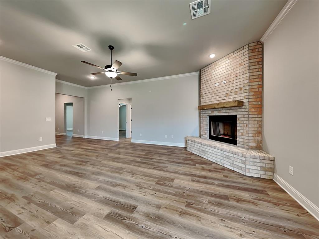 2108 Gabriel Drive Sherman, TX 75092 - Photo 2 of 16 a view of an empty room with a fireplace