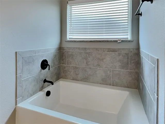 a bathroom with a bathtub