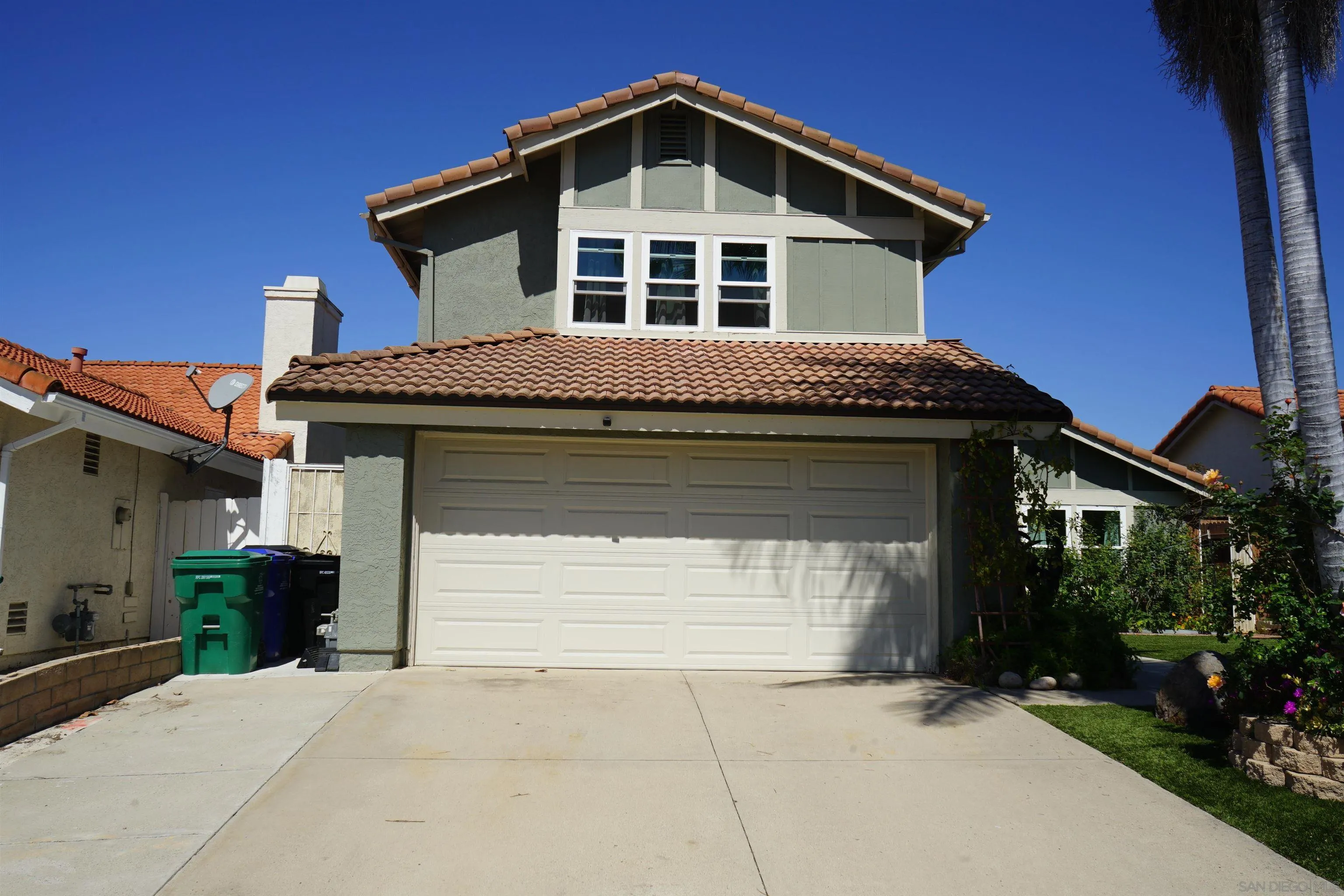 7842 Hemphill Drive San Diego, CA 92126 - Photo 1 of 29 a front view of a house with a yard