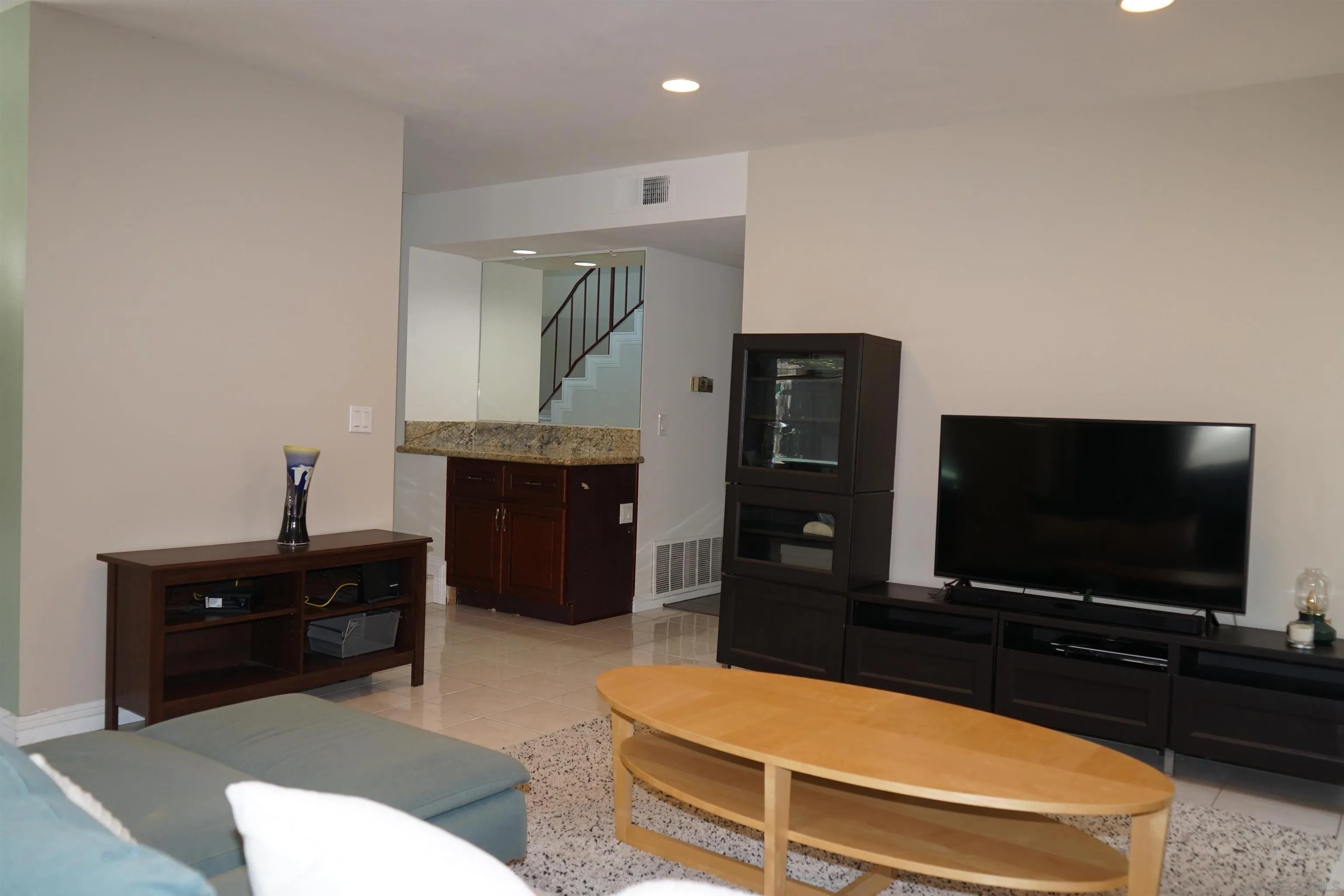 7842 Hemphill Drive San Diego, CA 92126 - Photo 13 of 29 a room with furniture and a flat screen tv