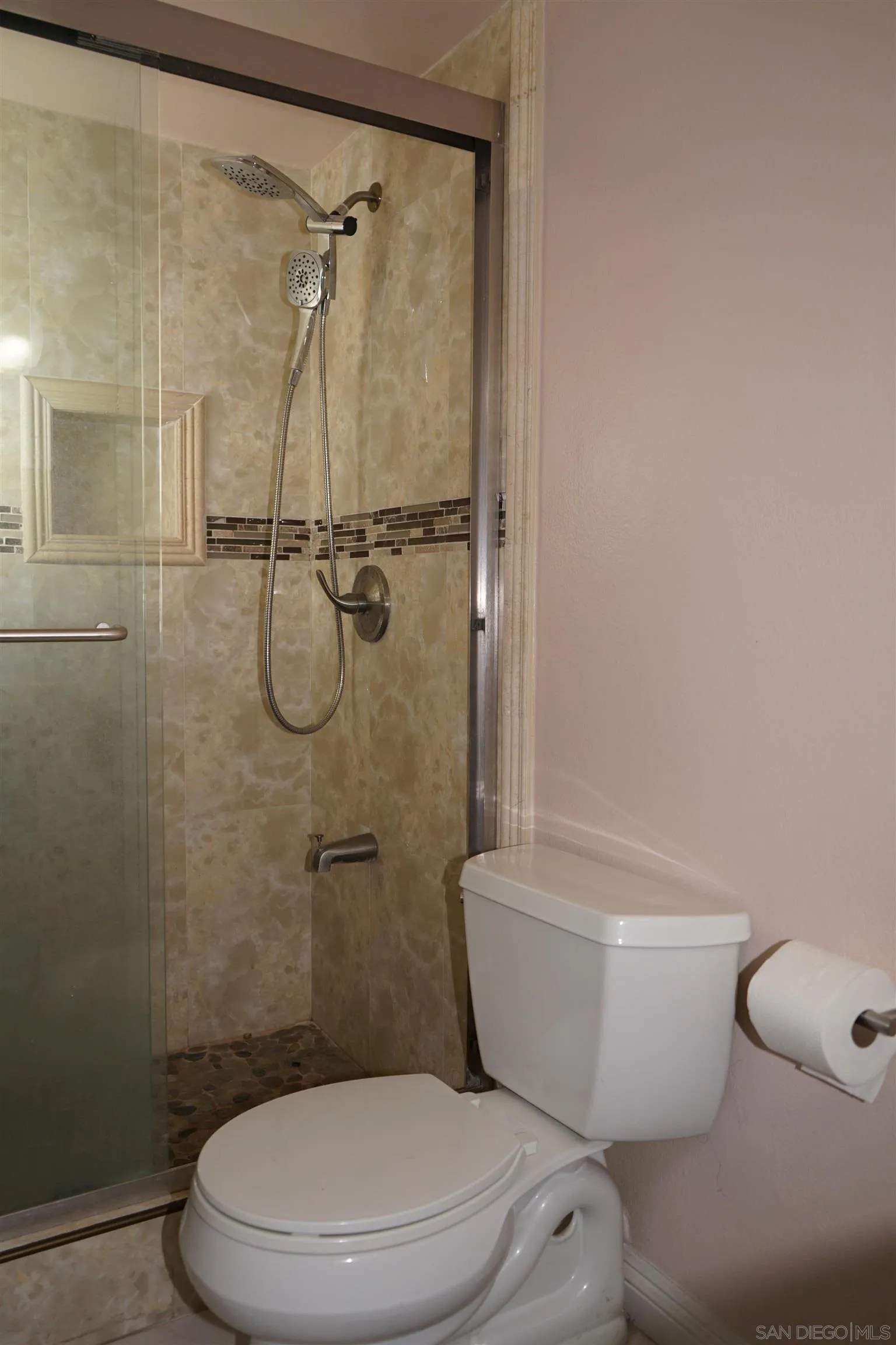 7842 Hemphill Drive San Diego, CA 92126 - Photo 17 of 29 a white toilet sitting next to a bath tub and a shower