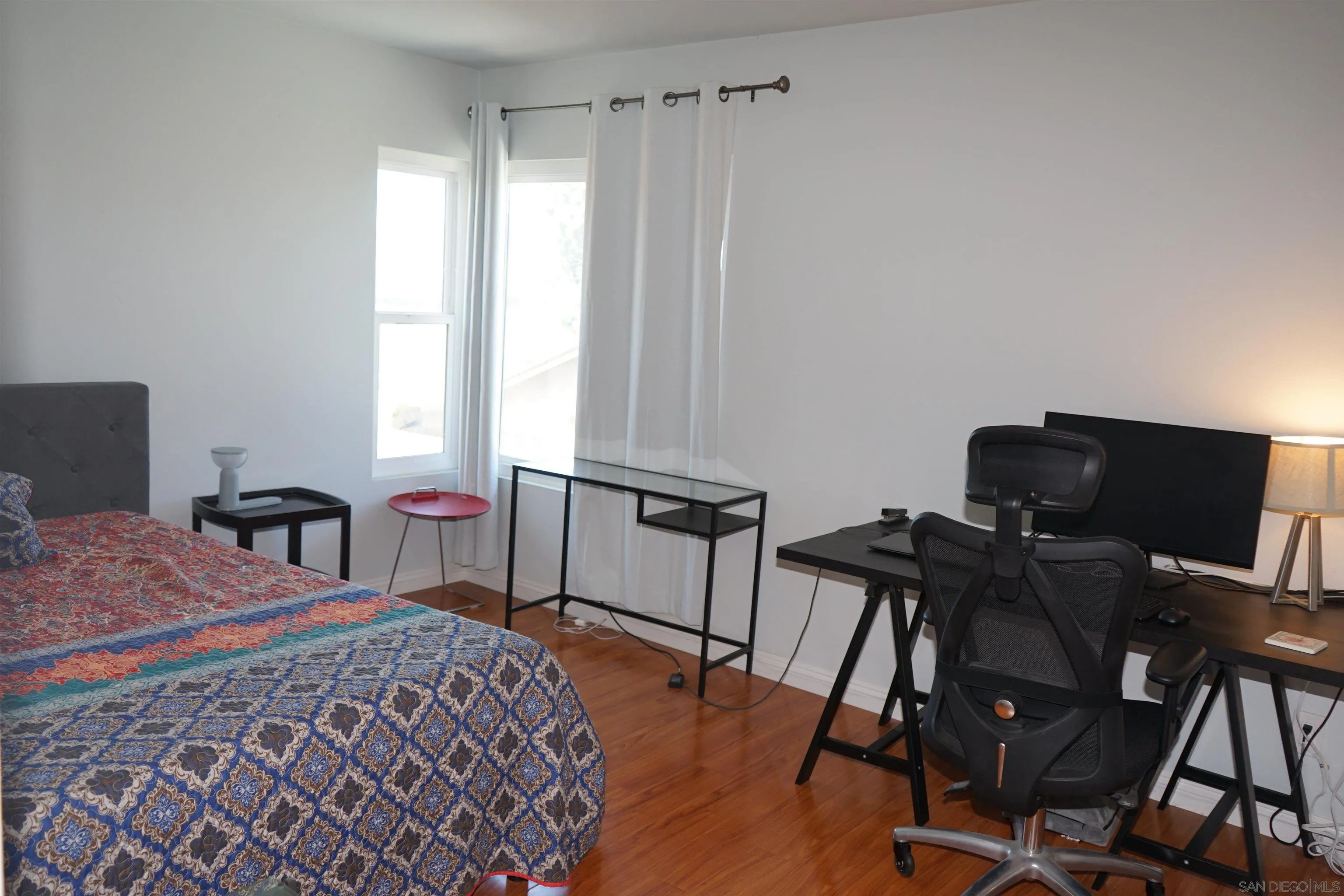 7842 Hemphill Drive San Diego, CA 92126 - Photo 19 of 29 a bedroom with a bed and a desk