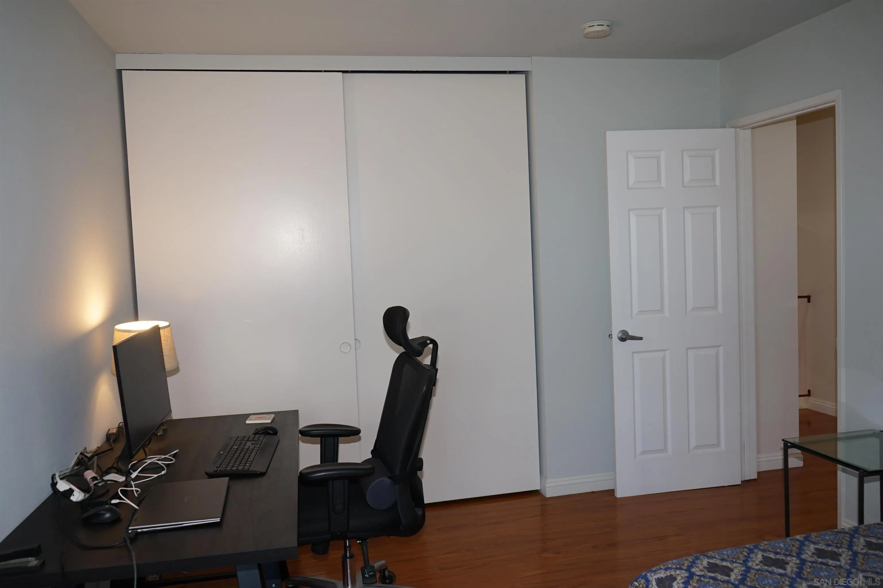7842 Hemphill Drive San Diego, CA 92126 - Photo 20 of 29 a view of a workspace with furniture and wooden floor