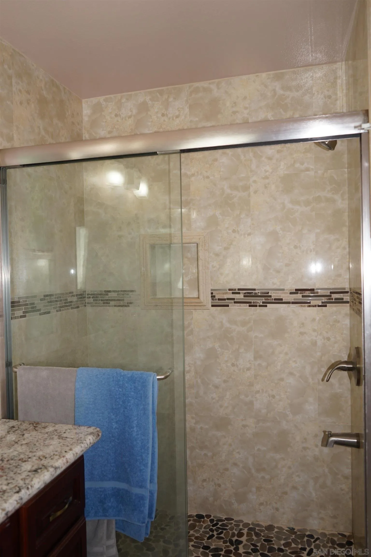 7842 Hemphill Drive San Diego, CA 92126 - Photo 23 of 29 a bathroom with a granite countertop shower and a sink