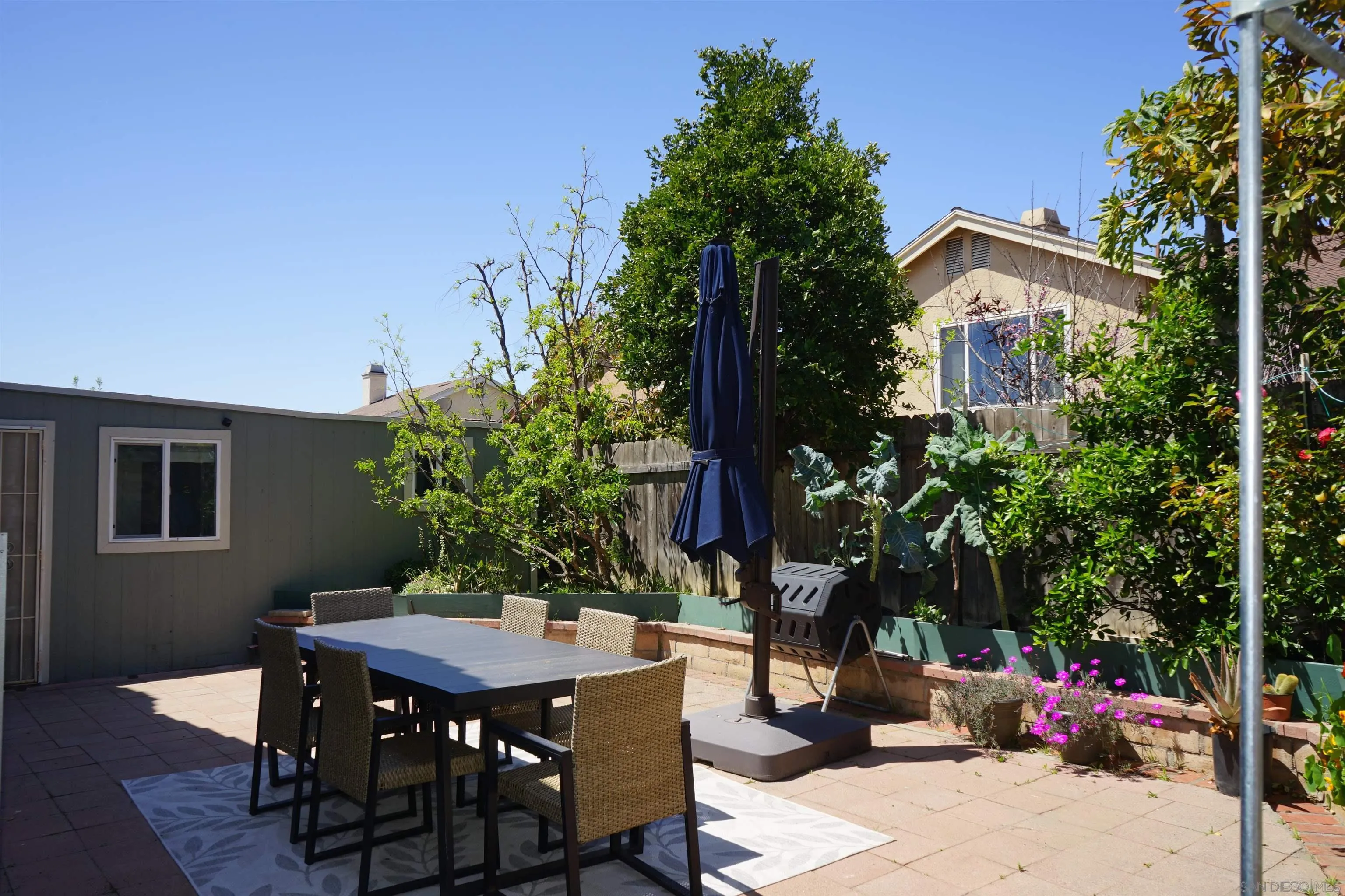 7842 Hemphill Drive San Diego, CA 92126 - Photo 29 of 29 a view of a dinning table and chairs in patio
