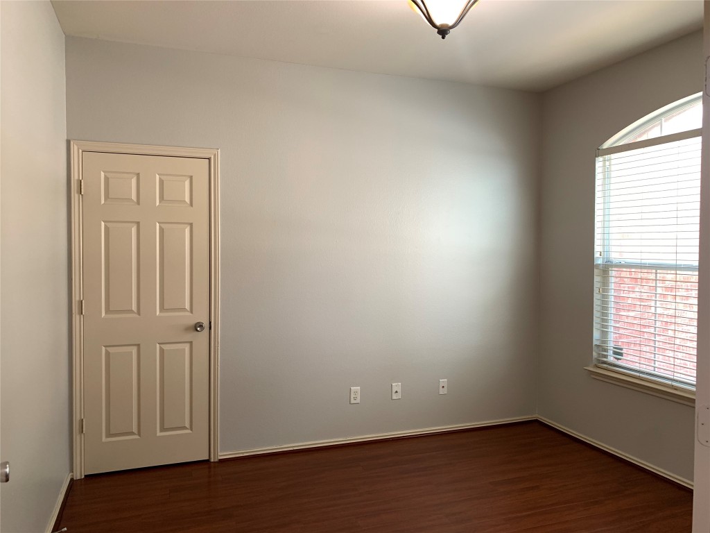 3667 Spring Canyon Trail Round Rock, TX 78681 - Photo 19 of 24 an empty room with wooden floor and windows
