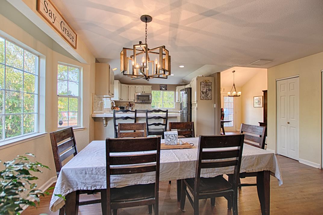 2230 Albert Lane Capitola, CA 95010 - Photo 7 of 34 a view of a dining room with furniture window and wooden floor