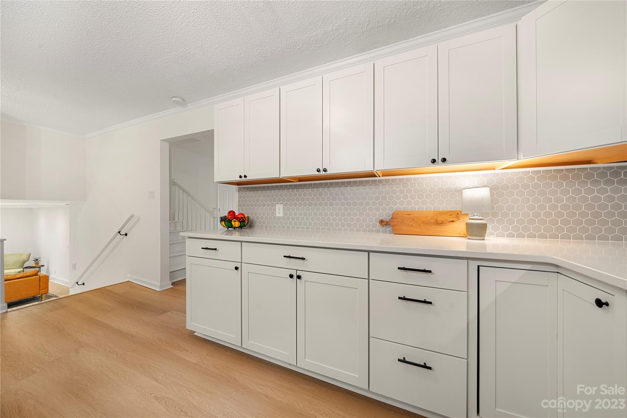 2130 Manawa Lane Tega Cay, SC 29708 - Photo 12 of 43 a kitchen with white cabinets and white appliances