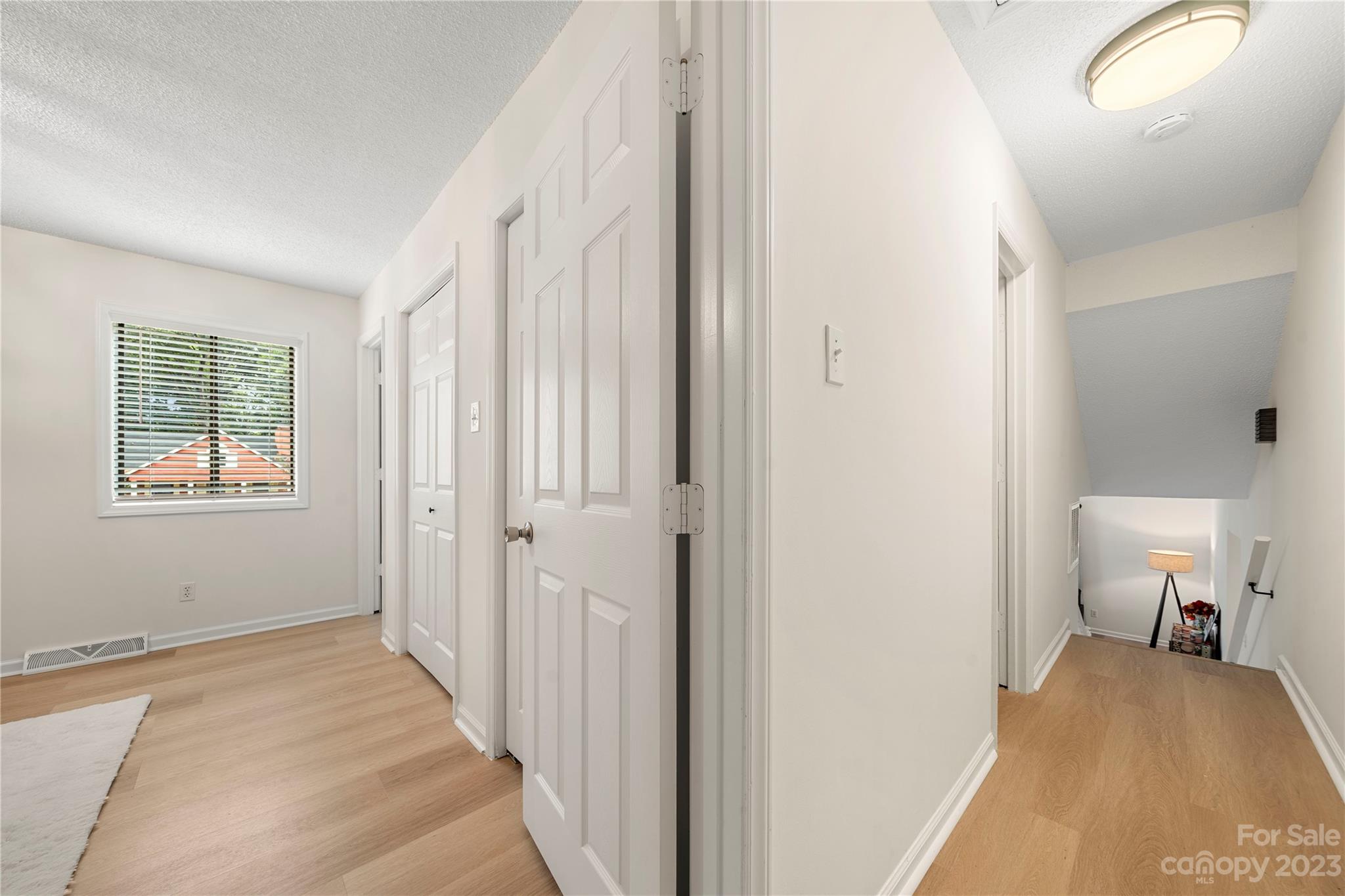 2130 Manawa Lane Tega Cay, SC 29708 - Photo 30 of 43 a view of a bedroom with a bed and hallway