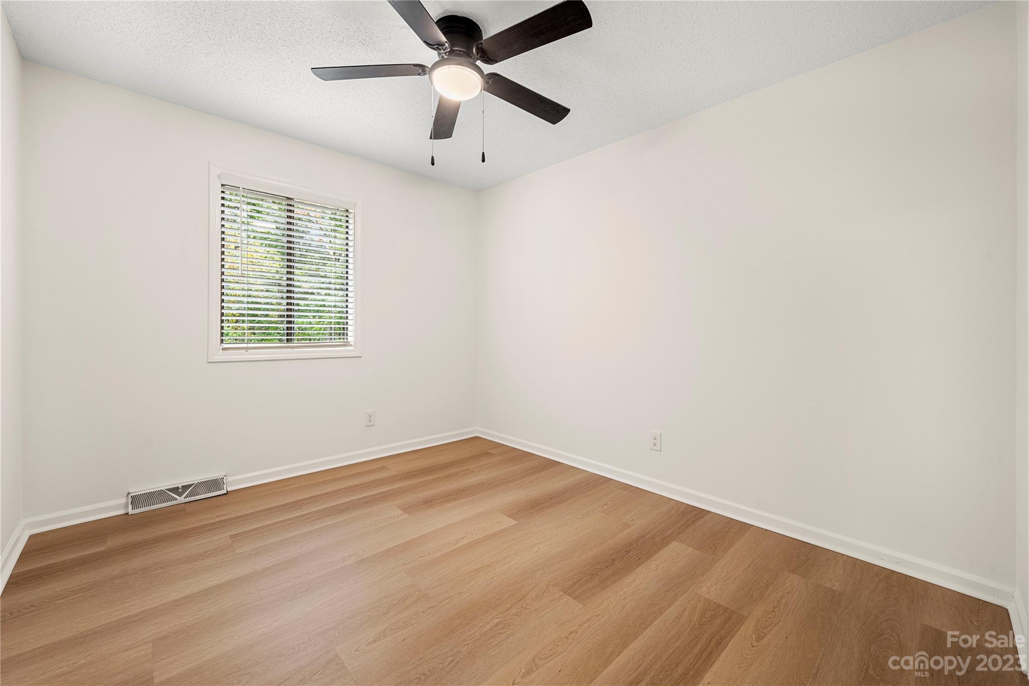 2130 Manawa Lane Tega Cay, SC 29708 - Photo 34 of 43 an empty room with a window and a fan