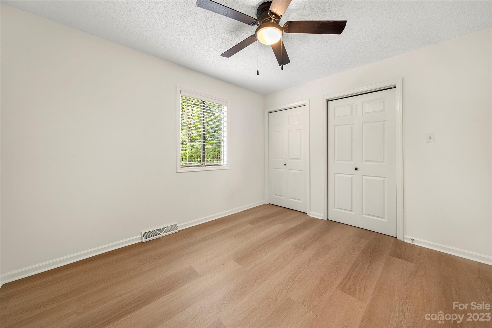 2130 Manawa Lane Tega Cay, SC 29708 - Photo 36 of 43 an empty room with windows and fan