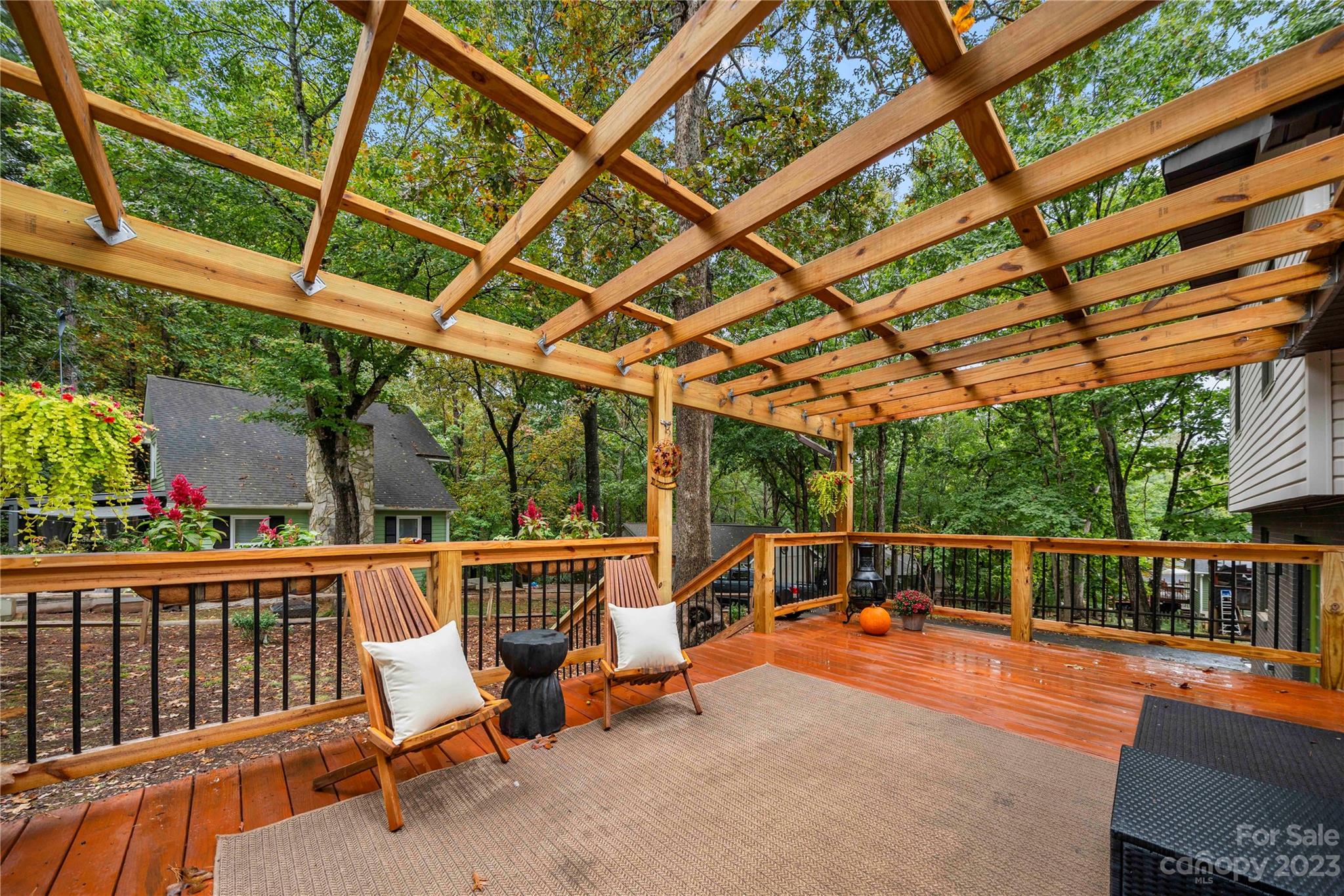 2130 Manawa Lane Tega Cay, SC 29708 - Photo 4 of 43 a view of a patio with a table chairs and wooden fence