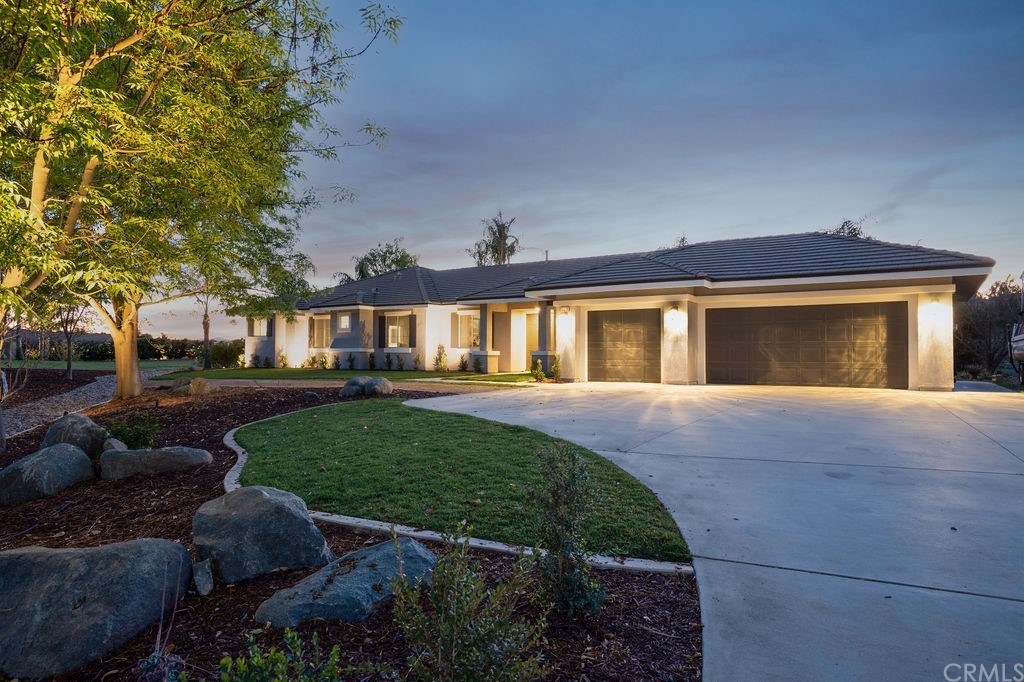 23629 Piedras Road Perris, CA 92570 - Photo 1 of 1 a front view of a house with a yard
