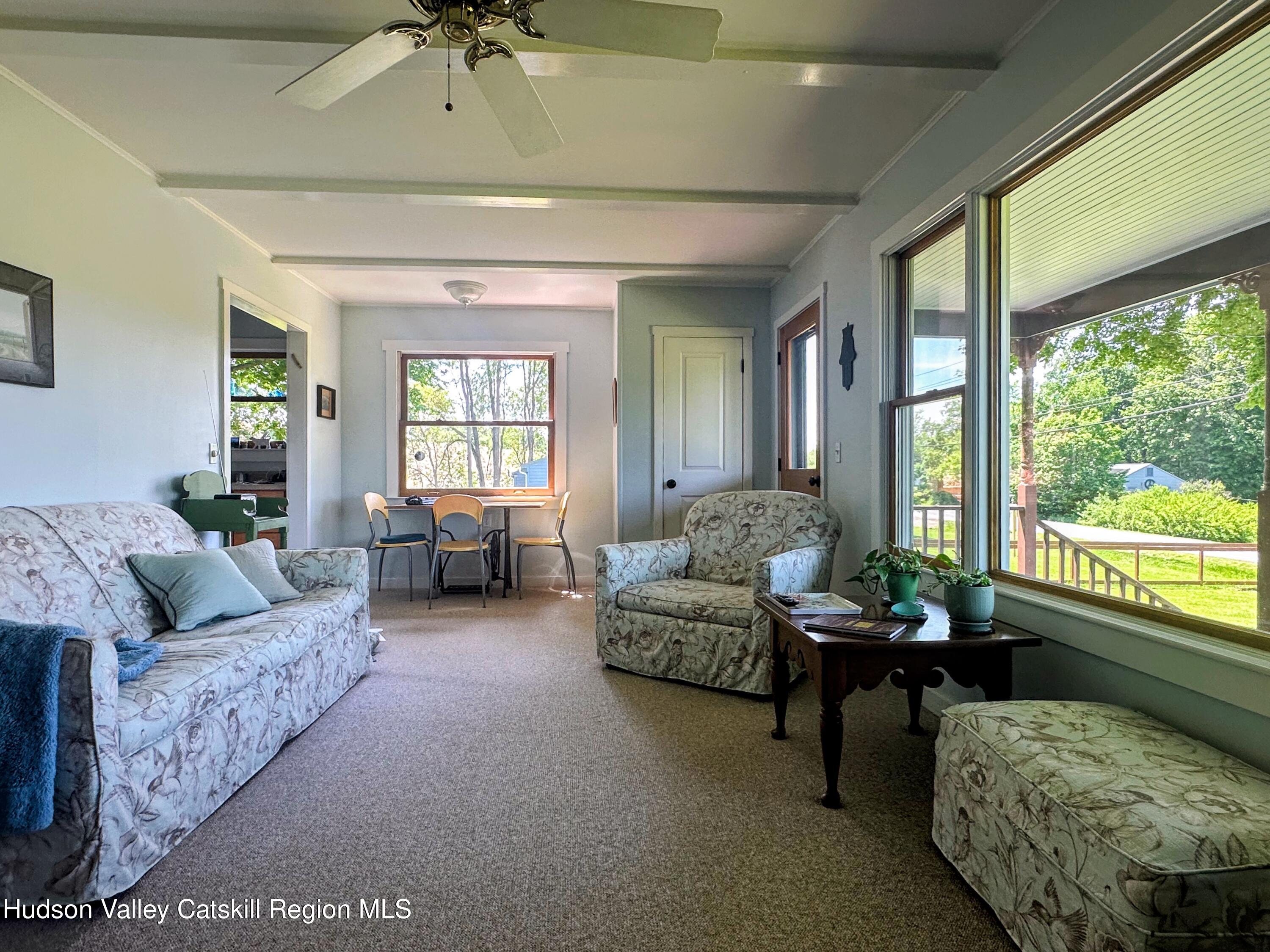 1492 County Road Copake, NY 12516 - Photo 9 of 34 a living room with furniture and a large window