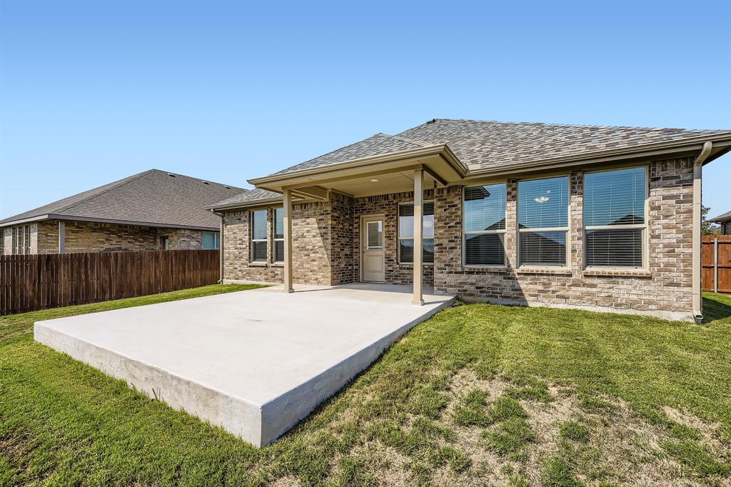1829 Ruffian Road Granbury, TX 76049 - Photo 26 of 39 a front view of a house with a yard