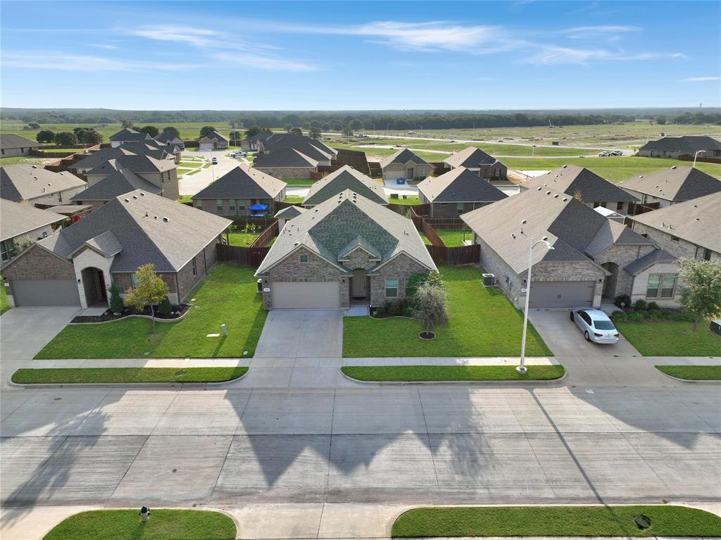 1829 Ruffian Road Granbury, TX 76049 - Photo 29 of 39 an aerial view of a house with a garden and lake view