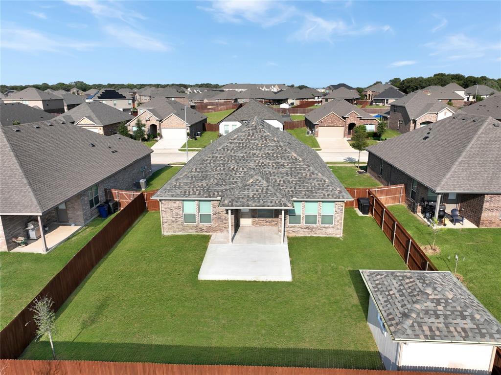 1829 Ruffian Road Granbury, TX 76049 - Photo 33 of 39 an aerial view of multiple houses with a yard