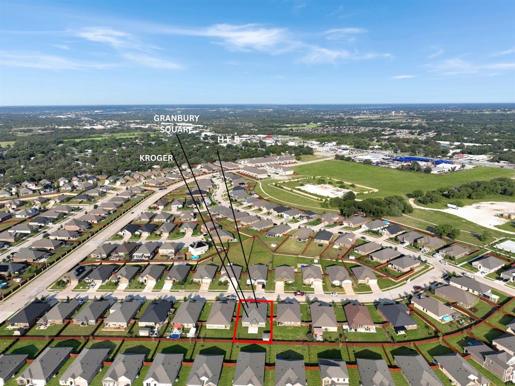 1829 Ruffian Road Granbury, TX 76049 - Photo 34 of 39 an aerial view of residential building with parking space